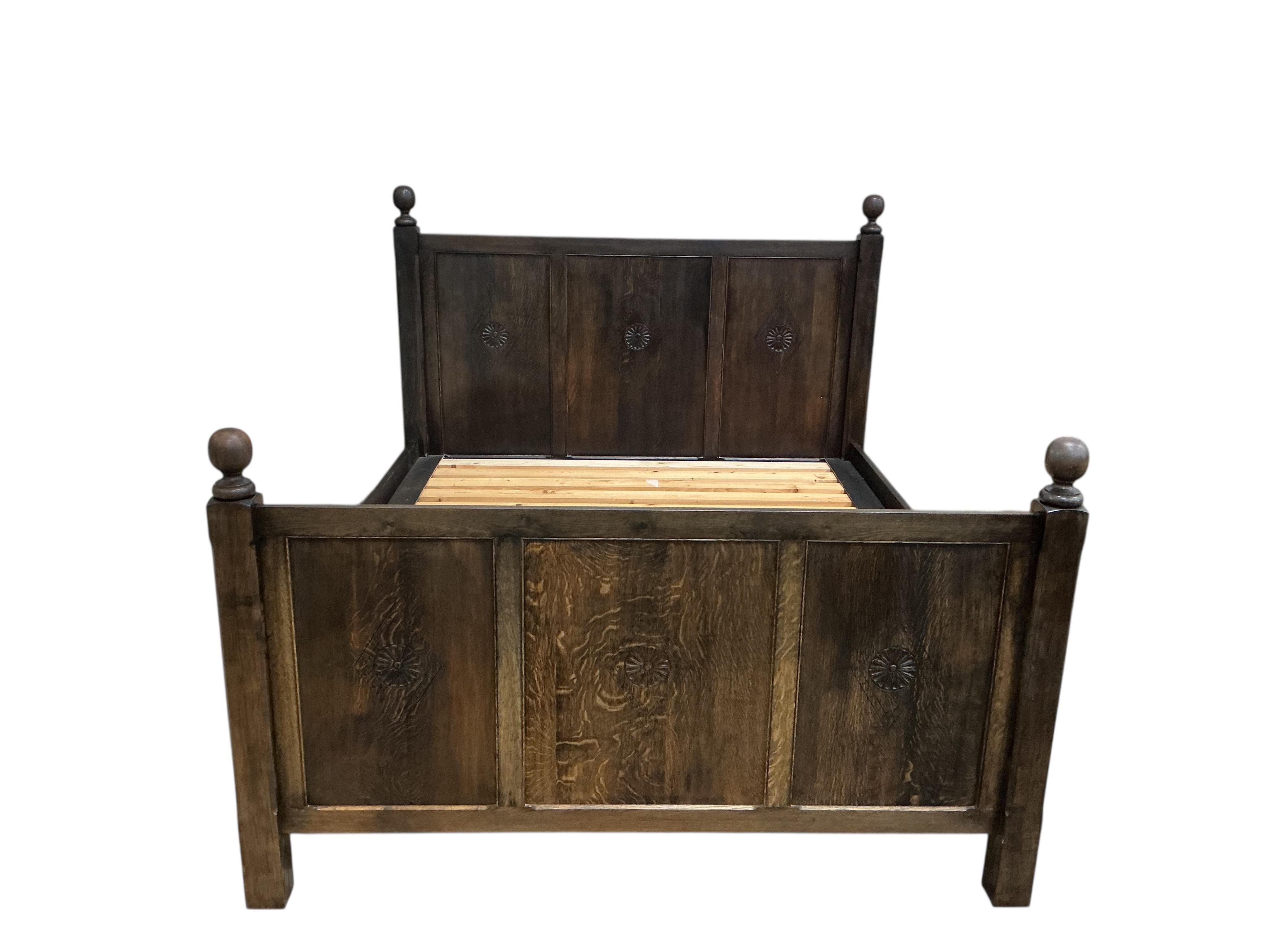 An 18th century style oak Superking double bed frame, width 190cm, length 216cm, height 168cm